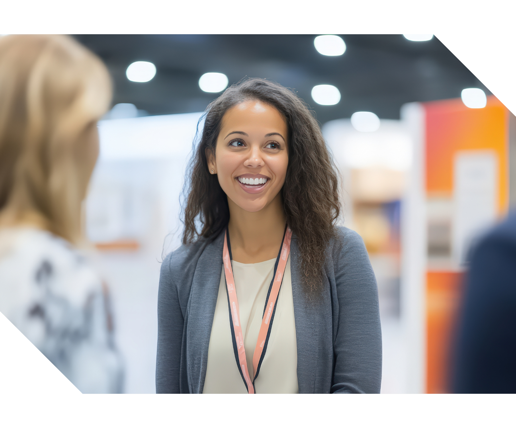 Attendees walking through a trade show floor with exhibitor booths and displays, representing trade shows, exhibitions, networking, and event management services.