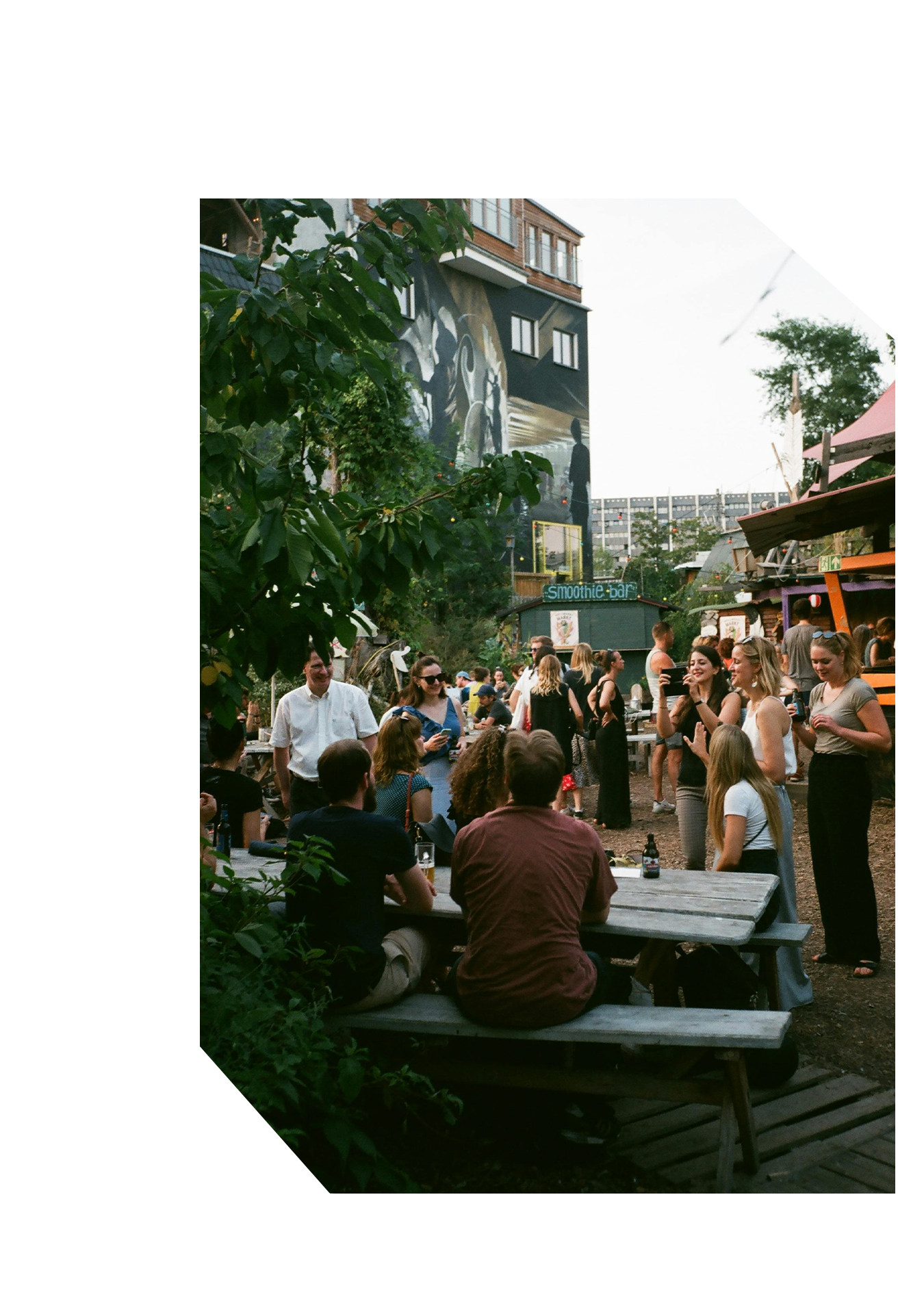 A number of people gathering outdoors for a social event